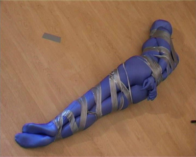 Rashir tape bound and gagged in a blue spandex zentai suit