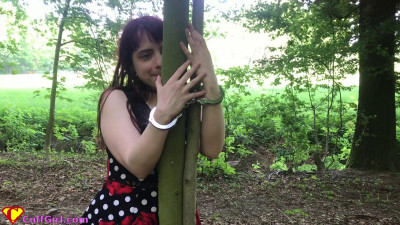 Cuffing Zara to a tree