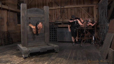 Two well used barn sluts restrained in strict bondage